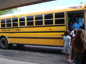 Students board the bus for their narrated mural tour.