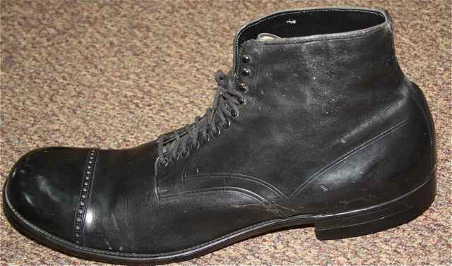 The size 35AA Robert Wadlow shoe has a hole worn in the sole.