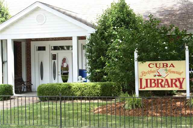 The hand painted Cuba library sign is one of Krovicka's commissions.