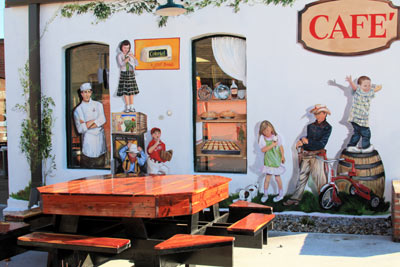 The mural on the rear of the Main Street Cafe enhances the outside seating area.