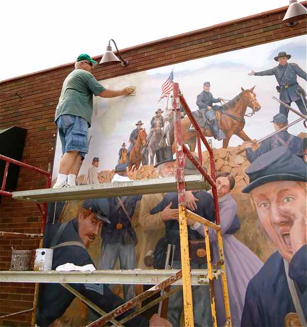 Artist Don Gray does restoration work on Civil War mural.