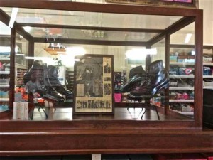 Robert Wadlow Shoes in their glass display case.