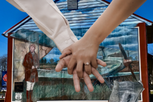 Couple in front of mural